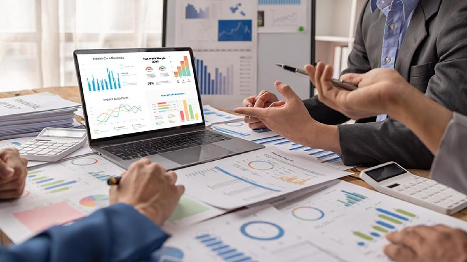 Advisers reviewing financial reports and performance dashboards